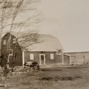 sepia photo of barn and out buildings